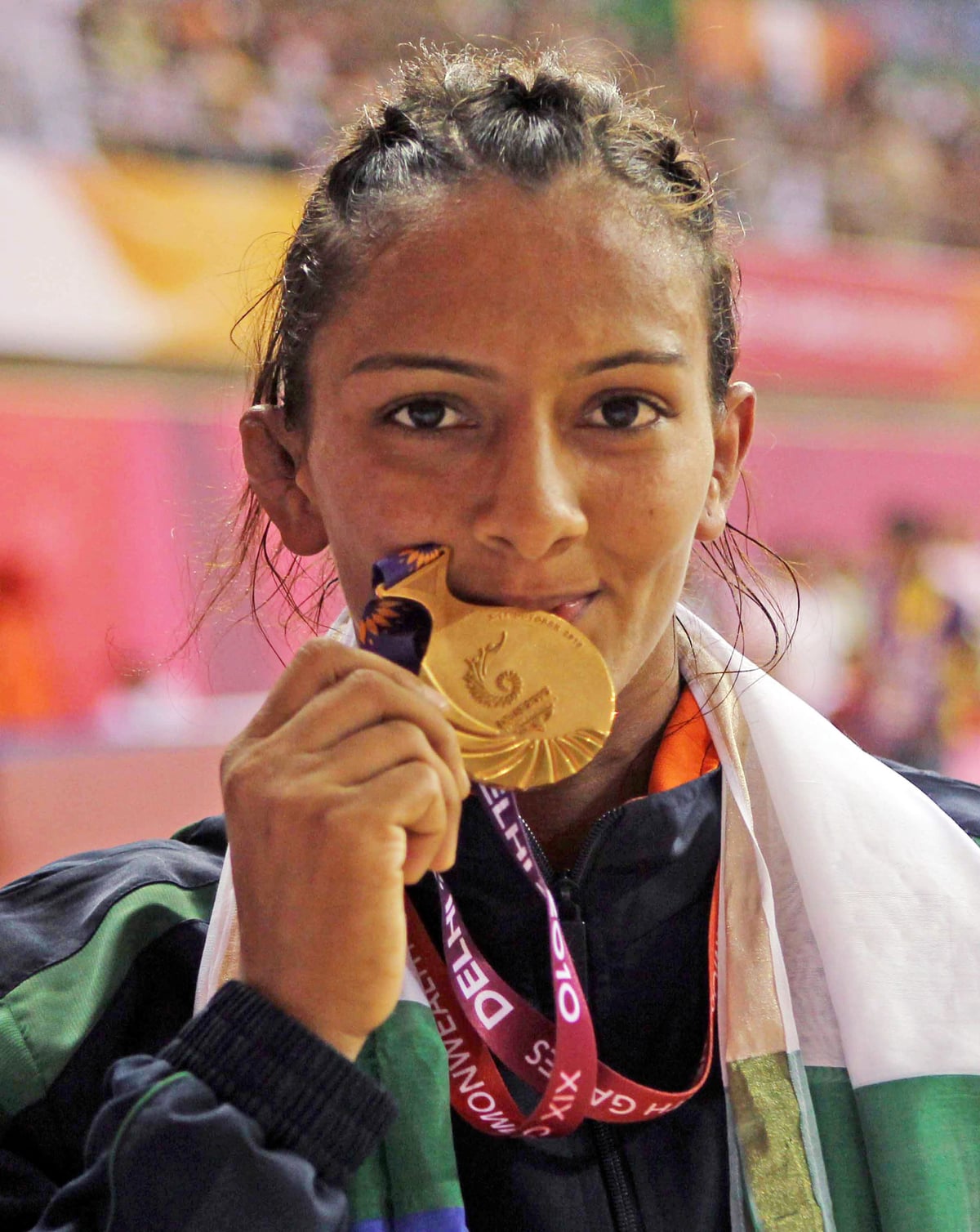 Geeta Phogat holding her gold medal at the 2010 Commonwealth Games